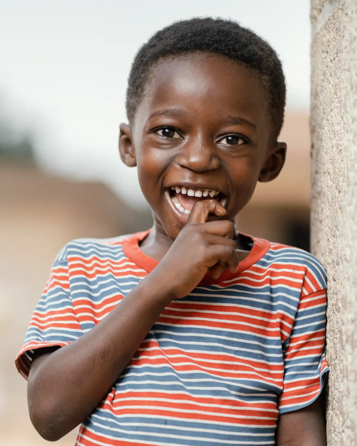 Smiling child representing the hope and opportunity created through Stacy Foundation programmes.
